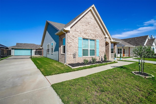 view of front of property featuring a front yard and a garage