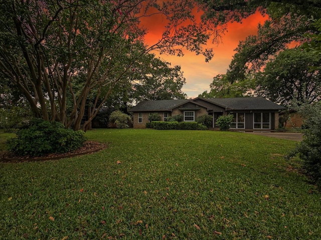 view of front of house with a lawn