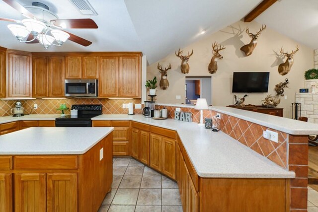 kitchen with hanging light fixtures, tasteful backsplash, sink, and stainless steel dishwasher