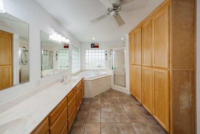 bathroom featuring tile patterned floors, ceiling fan, vanity, and shower with separate bathtub