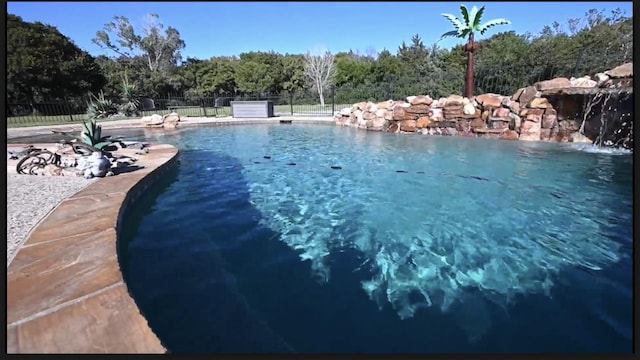 view of pool featuring pool water feature