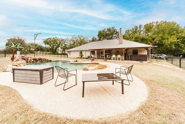 view of pool featuring a hot tub and a patio area