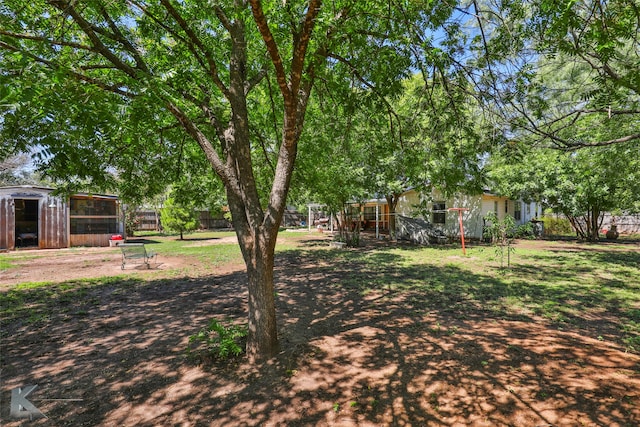 view of yard with a storage unit