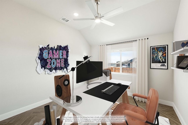 office space featuring vaulted ceiling, ceiling fan, and parquet flooring