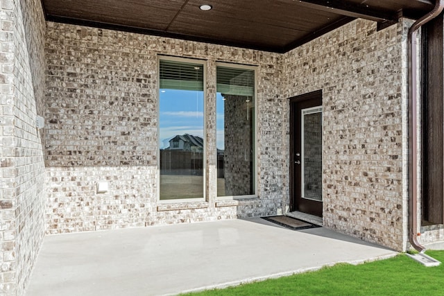 doorway to property featuring a patio