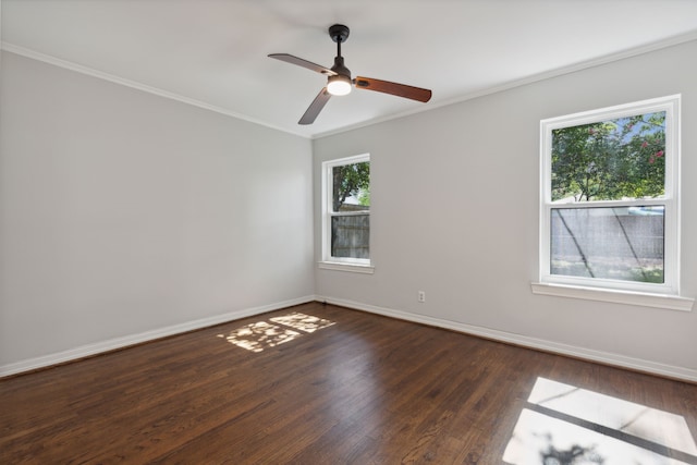 empty room with dark wood-type flooring, ceiling fan, and a healthy amount of sunlight