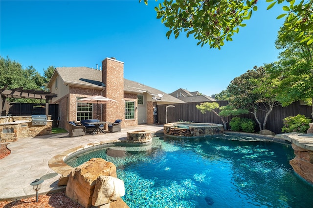 view of swimming pool featuring a patio and an in ground hot tub