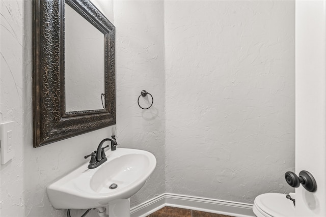 bathroom with sink and toilet