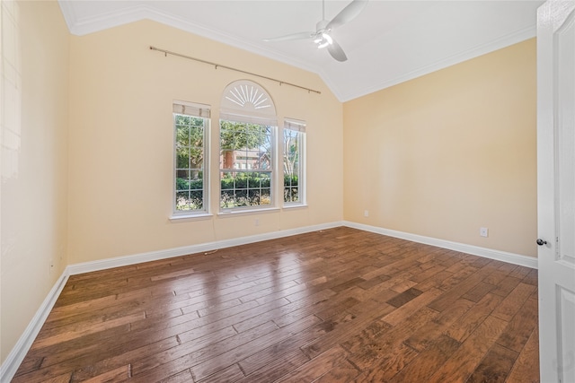 spare room with crown molding, vaulted ceiling, ceiling fan, and dark wood-type flooring