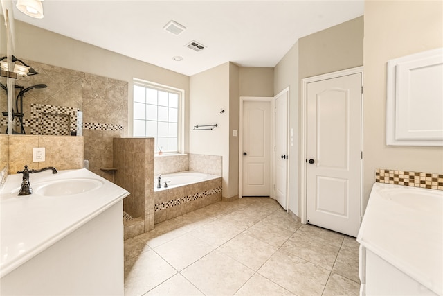 bathroom featuring shower with separate bathtub, tile patterned floors, and vanity