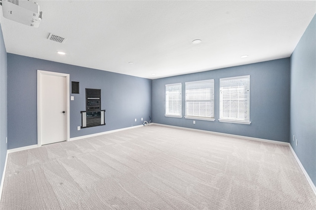 unfurnished room with light carpet