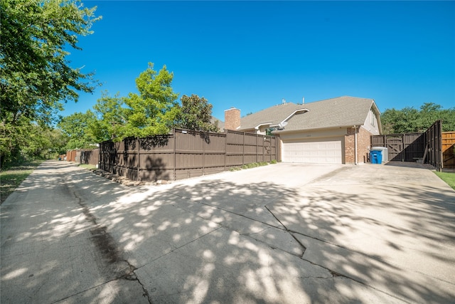 view of property exterior featuring a garage