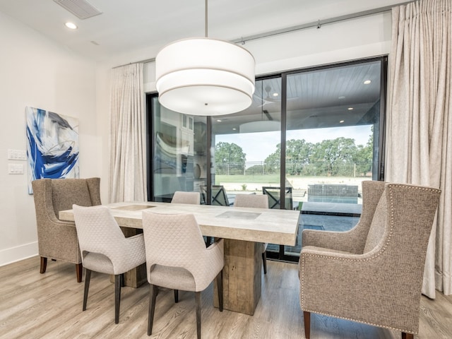 dining space featuring hardwood / wood-style floors