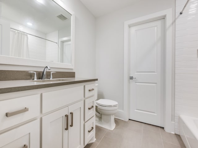 full bathroom featuring shower / bath combo with shower curtain, vanity, tile patterned flooring, and toilet