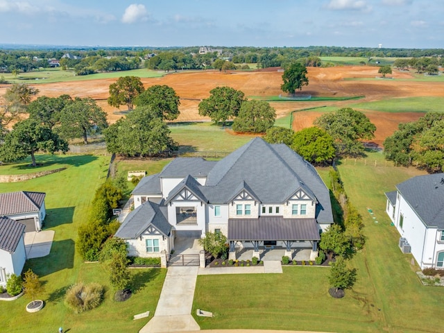 birds eye view of property featuring a rural view