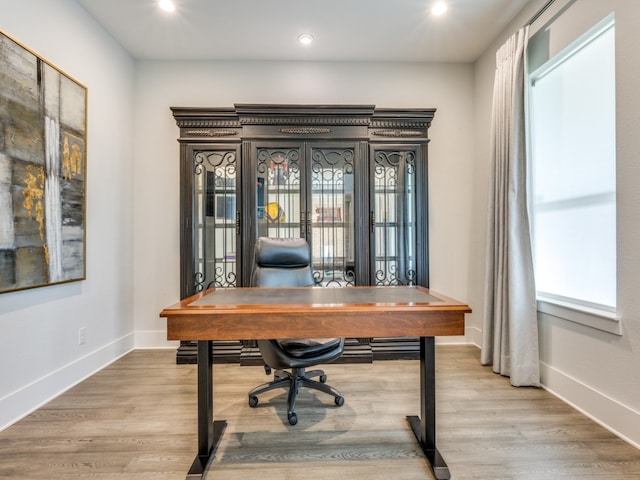 office area featuring french doors, light wood-type flooring, and a wealth of natural light