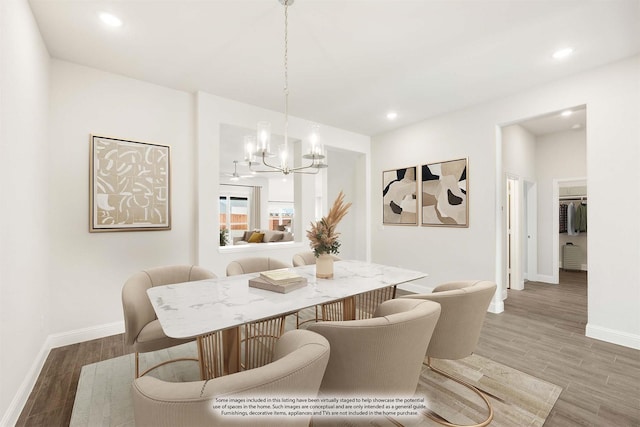 dining space with an inviting chandelier and wood-type flooring