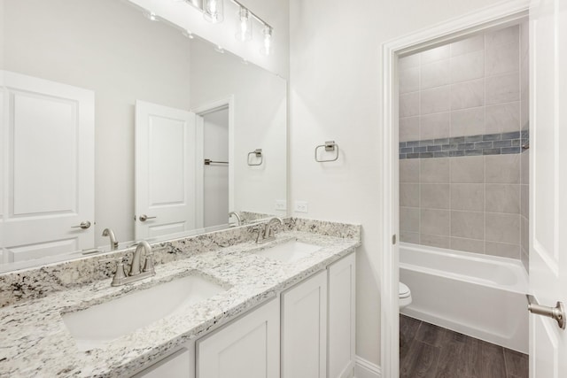 bathroom featuring hardwood / wood-style flooring, vanity, and toilet