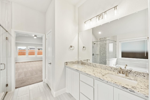 bathroom featuring vanity, ceiling fan, tile patterned flooring, and a shower with door