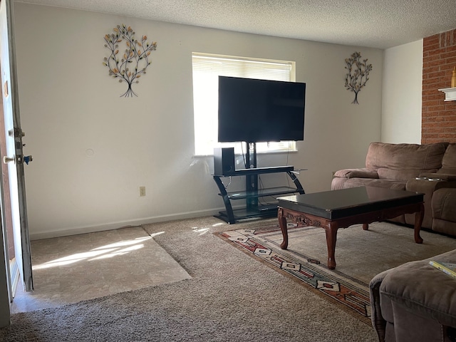 living room featuring carpet and a textured ceiling