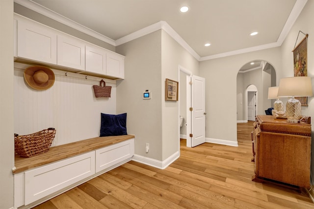 mudroom with crown molding and light hardwood / wood-style flooring