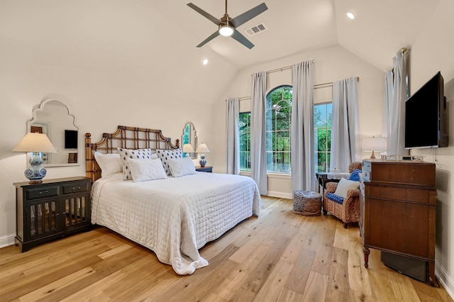 bedroom featuring ceiling fan, light hardwood / wood-style flooring, and vaulted ceiling