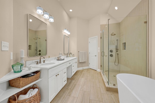 bathroom featuring vanity and plus walk in shower