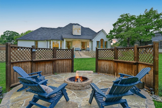 view of patio with a fire pit