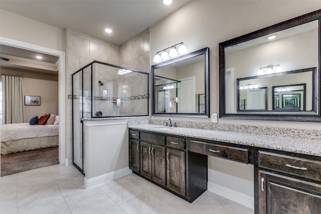 bathroom featuring an enclosed shower and vanity