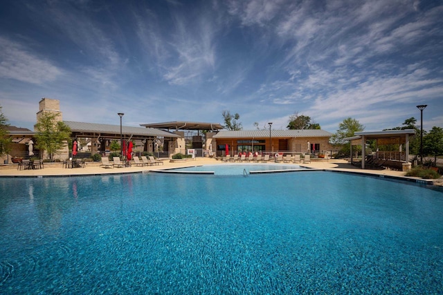 view of swimming pool with a patio area