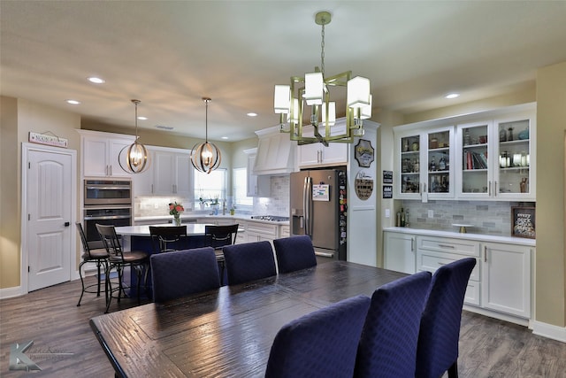 dining area featuring dark wood-type flooring