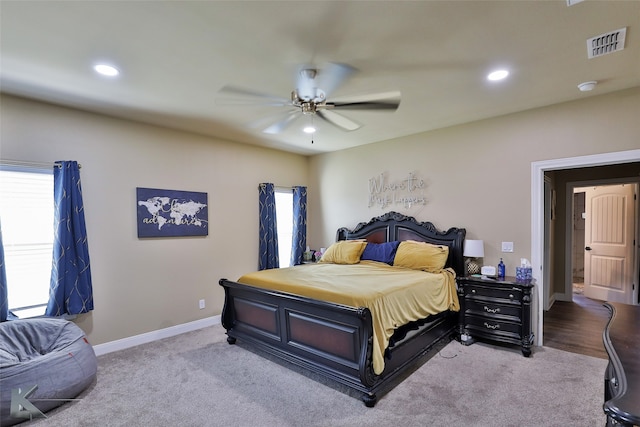 bedroom featuring ceiling fan and light colored carpet