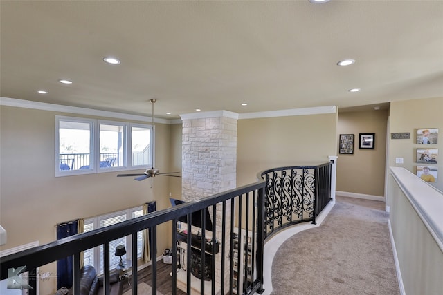 hall featuring light colored carpet and crown molding