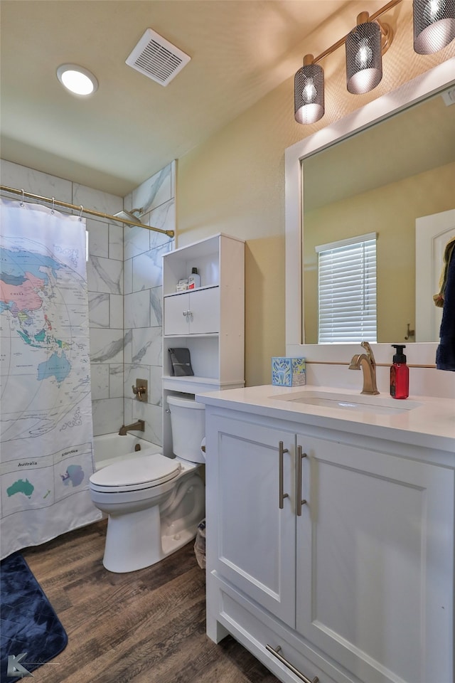 full bathroom with wood-type flooring, vanity, toilet, and shower / bathtub combination with curtain