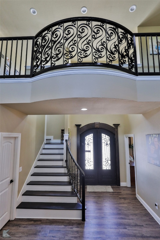 foyer entrance with dark hardwood / wood-style flooring