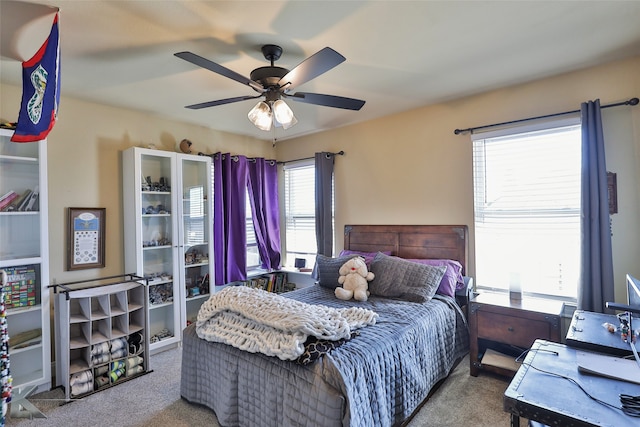 carpeted bedroom featuring ceiling fan