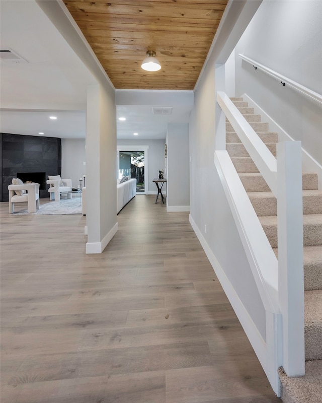 corridor with wooden ceiling and wood-type flooring