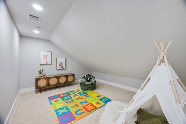 rec room featuring lofted ceiling and carpet floors