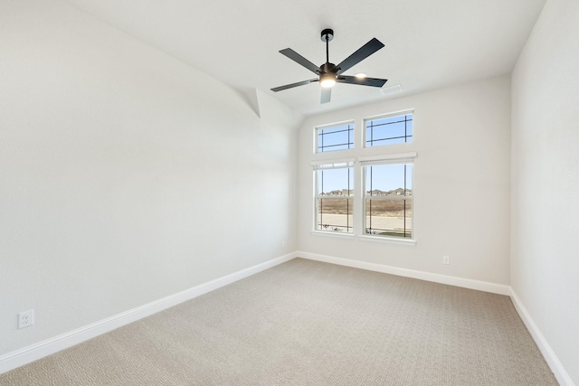 spare room featuring carpet and ceiling fan