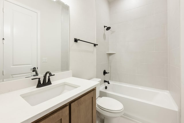 full bathroom featuring vanity, toilet, and tiled shower / bath combo