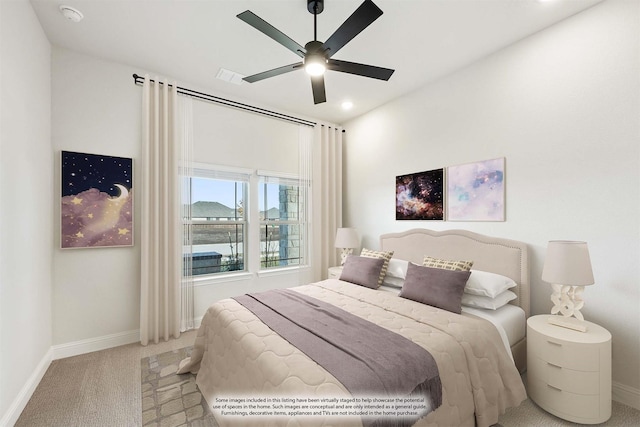 bedroom with light colored carpet and ceiling fan