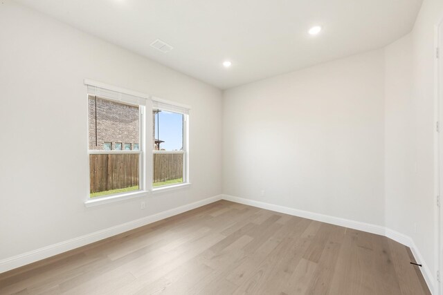 unfurnished room featuring light hardwood / wood-style floors