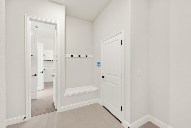 mudroom with light tile patterned floors