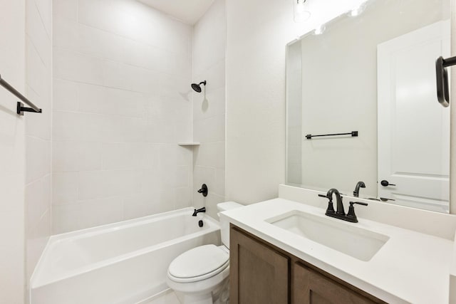 full bathroom featuring vanity, toilet, and tiled shower / bath