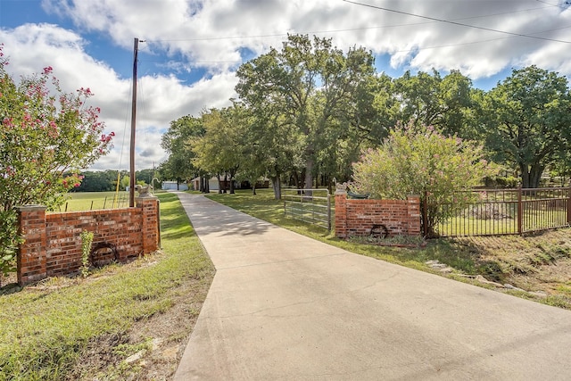 view of home's community featuring a lawn