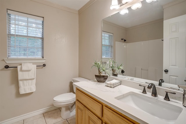 bathroom featuring vanity, plenty of natural light, toilet, and tile patterned floors