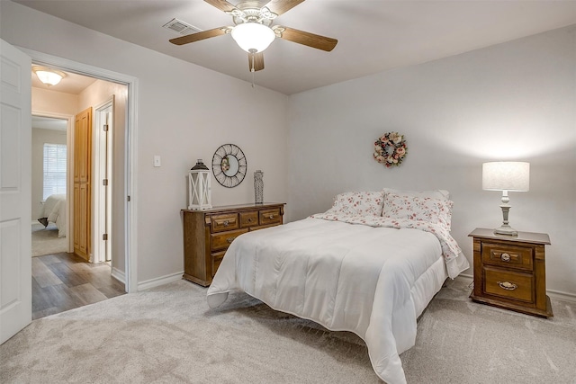 bedroom featuring ceiling fan and light hardwood / wood-style flooring