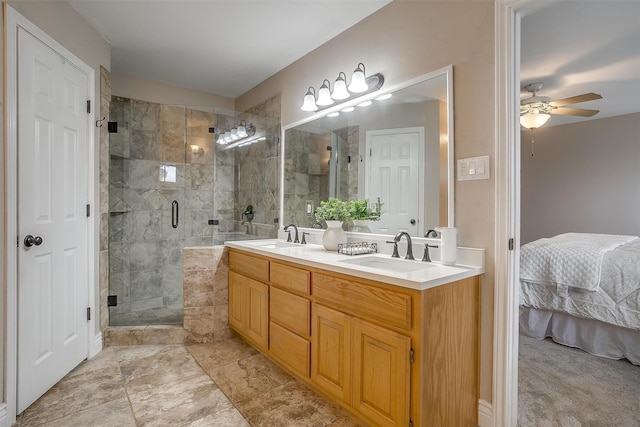 bathroom with ceiling fan, vanity, and an enclosed shower