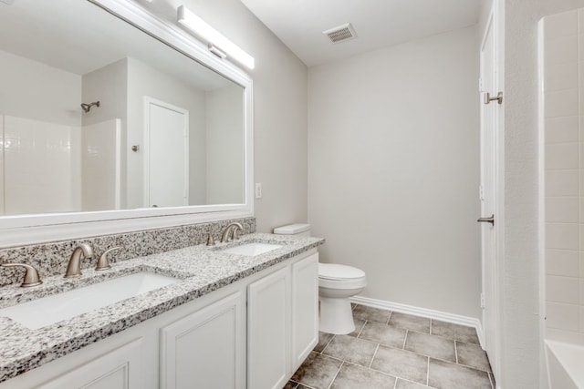 full bathroom featuring tub / shower combination, tile patterned flooring, vanity, and toilet