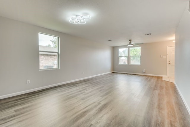 empty room featuring light hardwood / wood-style floors and ceiling fan